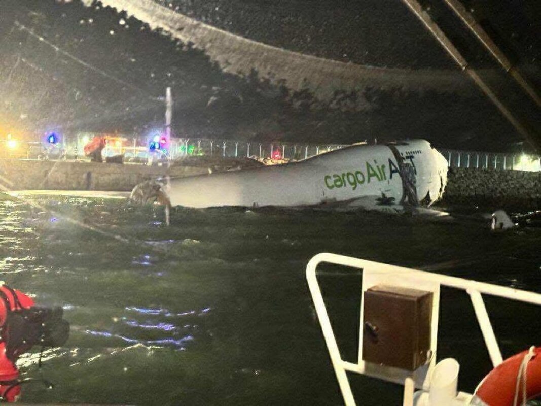 A damaged ACT Airlines B747 freighter in the sea after a landing accident in Hong Kong