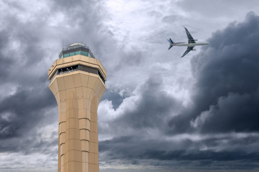 Control tower and passing aircraft