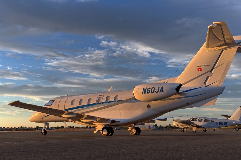 A business jet parked on the tarmac